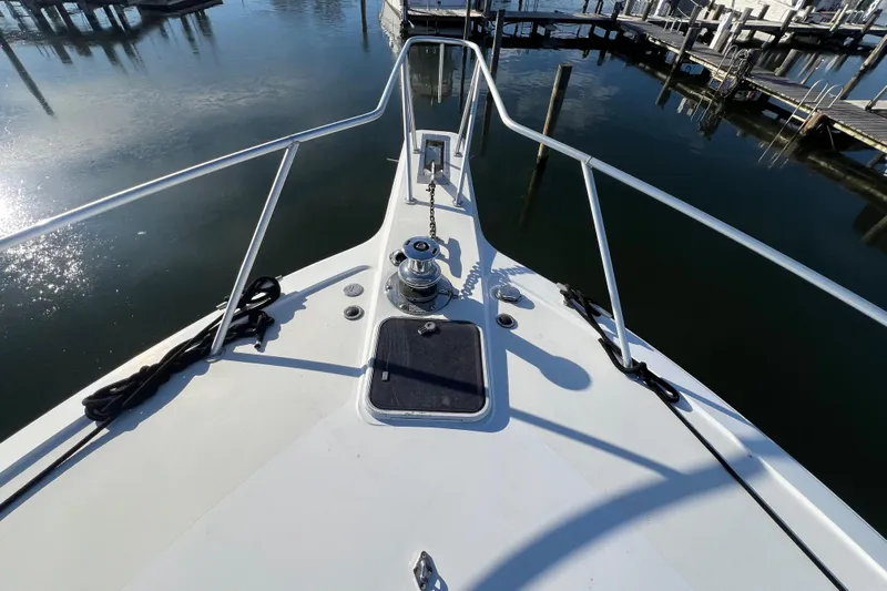 The Oar Deal Yacht Photos Pics Bow view of 1999 Ocean Yachts 56 Super Sport at marina.