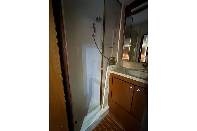 The Oar Deal Yacht Photos Pics Bathroom interior of 1999 Ocean Yachts 56 Super Sport with shower and vanity.