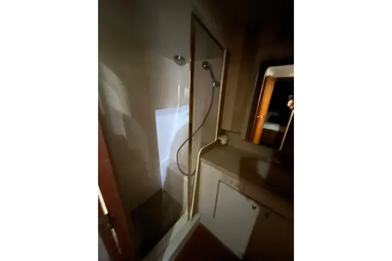 The Oar Deal Yacht Photos Pics Bathroom interior of 1999 Ocean Yachts 56 Super Sport with shower and vanity.