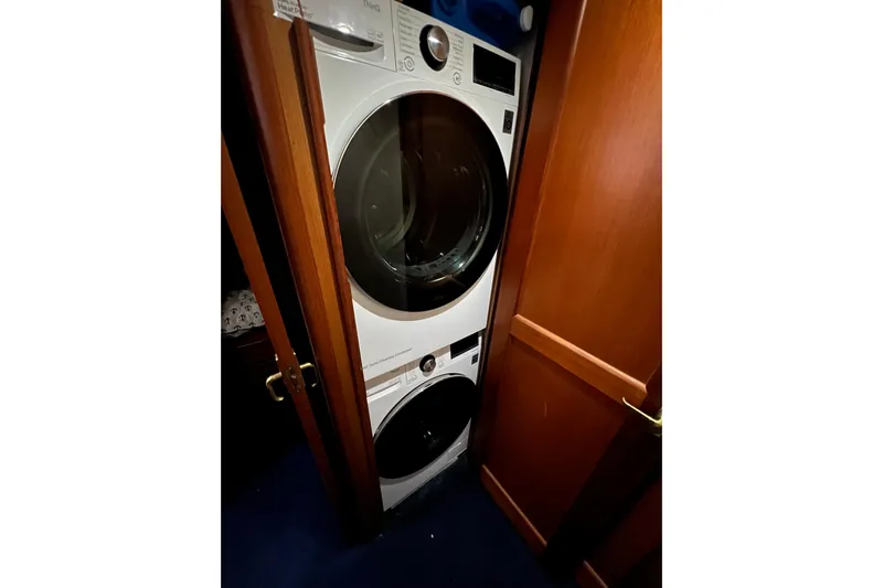 The Oar Deal Yacht Photos Pics Stacked washer and dryer in 1999 Ocean Yachts 56 Super Sport interior.