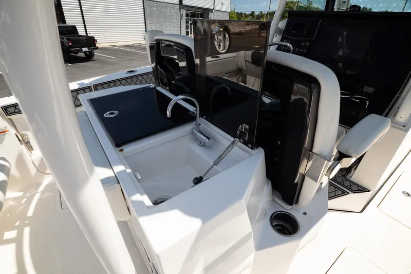  Yacht Photos Pics 2018 Wellcraft 302 Fisherman boat interior with sink and control panel.