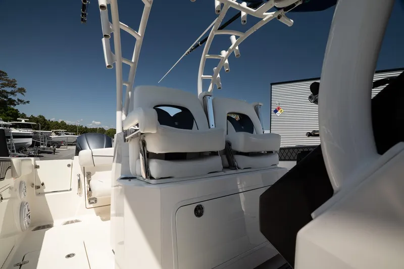  Yacht Photos Pics 2018 Wellcraft 302 Fisherman boat interior with white seating and modern design.