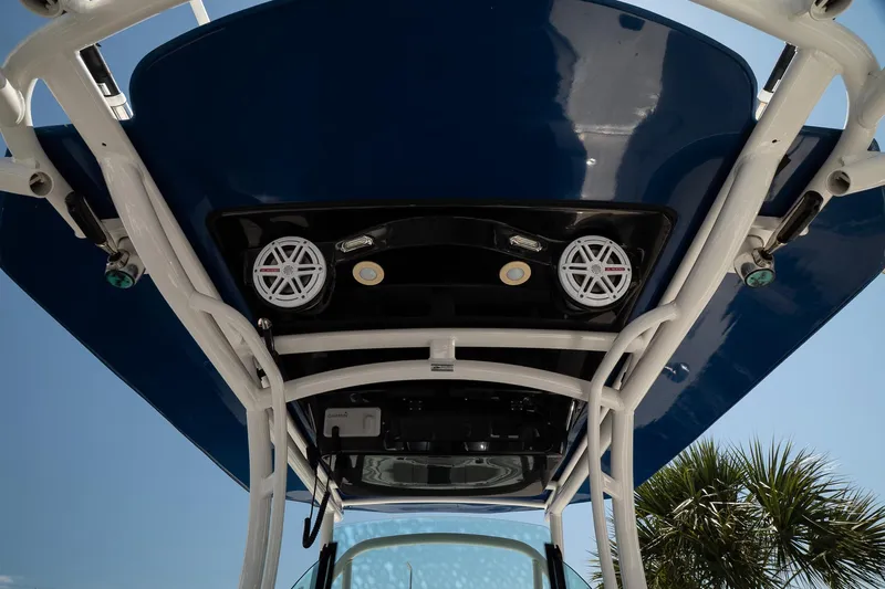  Yacht Photos Pics 2018 Wellcraft 302 Fisherman boat's overhead view with speakers and blue canopy.