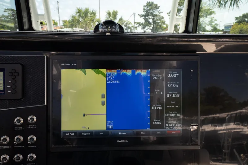  Yacht Photos Pics Garmin navigation display on 2018 Wellcraft 302 Fisherman boat dashboard.