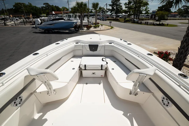  Yacht Photos Pics 2018 Wellcraft 302 Fisherman boat interior with seating and storage, docked at a marina.