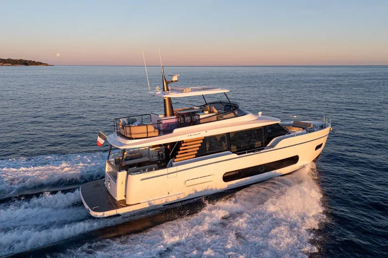  Yacht Photos Pics 2025 Azimut Magellano 60 yacht cruising at sunset on open sea.