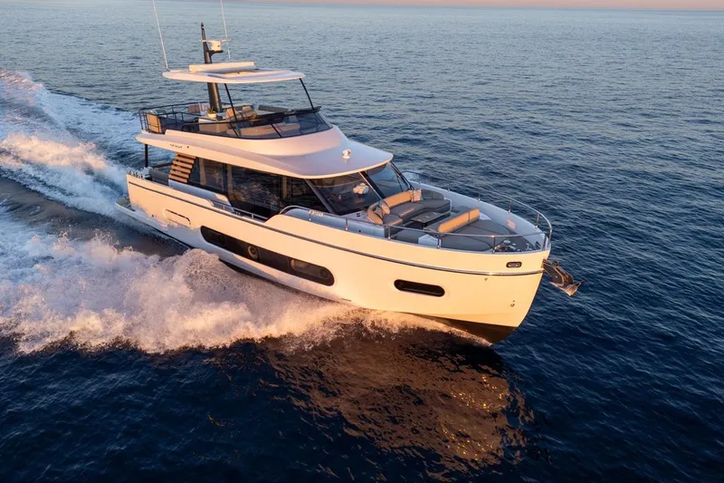  Yacht Photos Pics 2025 Azimut Magellano 60 yacht cruising on open sea at sunset.