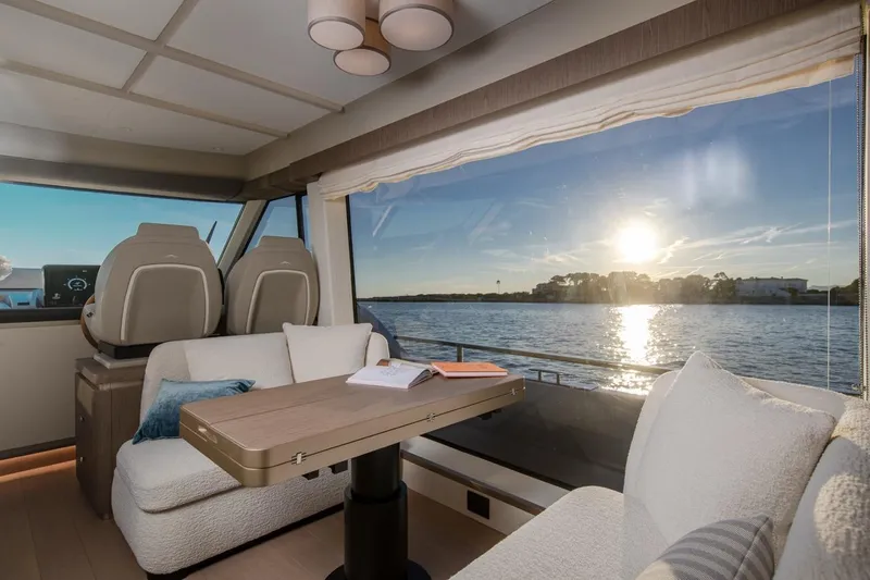  Yacht Photos Pics Luxurious interior of 2025 Azimut Magellano 60 yacht with scenic sunset view.