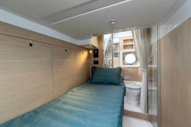  Yacht Photos Pics Interior of Azimut Magellano 60 yacht, 2025 model, featuring bed and bathroom.