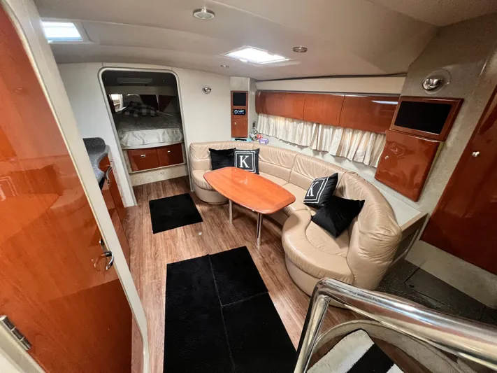 Gracie B Yacht Photos Pics Luxurious 2006 Formula 40 PC yacht interior with leather seating, wooden table, and modern decor.