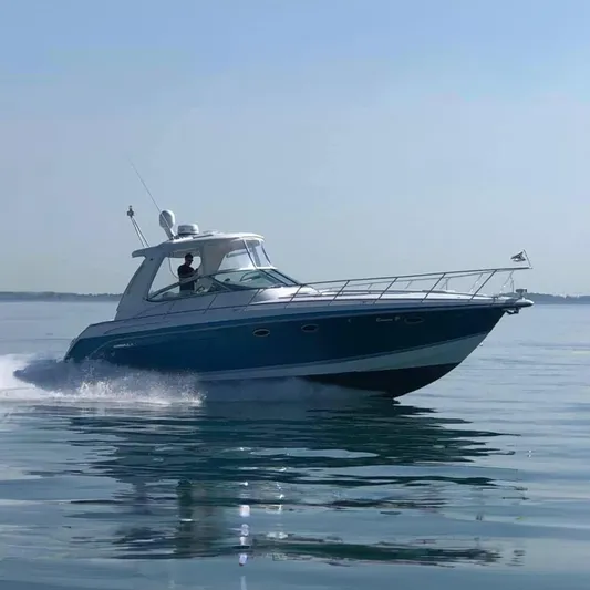 Gracie B Yacht Photos Pics 2006 Formula 40 PC yacht cruising on calm waters under clear skies.