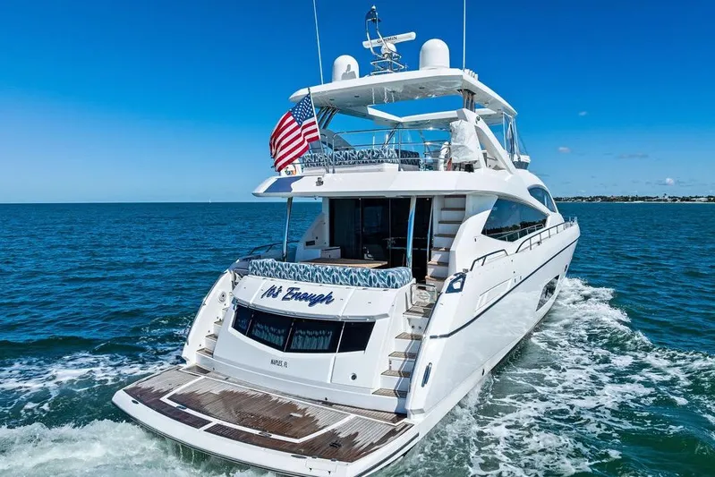 It's Enough Yacht Photos Pics Luxurious 2013 Sunseeker Manhattan 73 yacht cruising on open water, featuring elegant design.