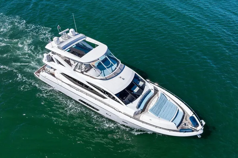 It's Enough Yacht Photos Pics Luxurious 2013 Sunseeker Manhattan 73 yacht cruising on open water.