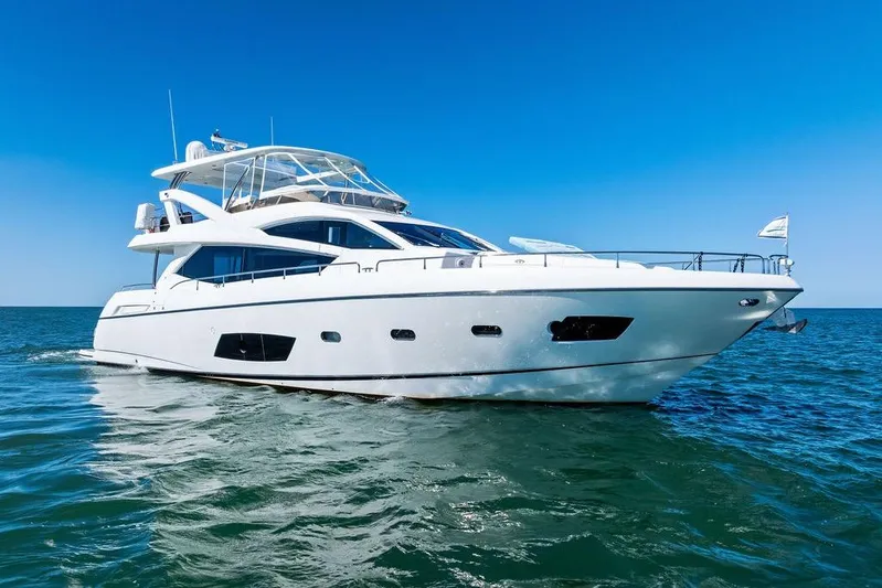 It's Enough Yacht Photos Pics Luxurious 2013 Sunseeker Manhattan 73 yacht cruising on open sea.