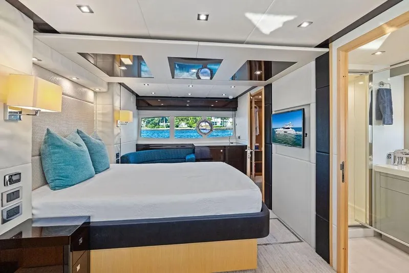 It's Enough Yacht Photos Pics Luxurious bedroom interior of 2013 Sunseeker Manhattan 73 yacht with modern decor and ocean view.