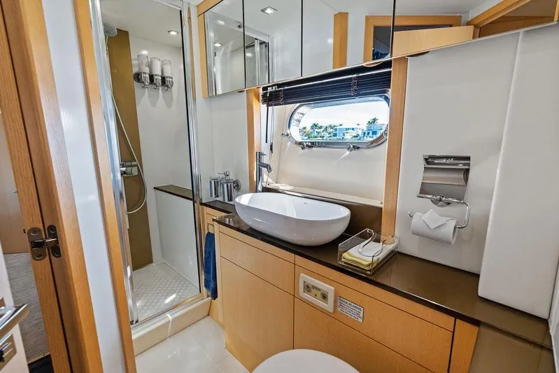 It's Enough Yacht Photos Pics Luxurious bathroom in 2013 Sunseeker Manhattan 73 yacht with modern fixtures and ocean view.