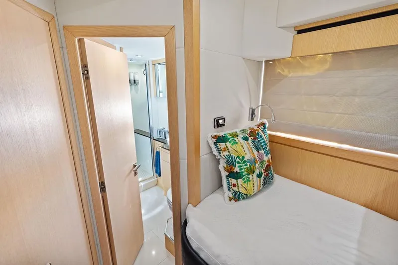 It's Enough Yacht Photos Pics Luxurious cabin interior of 2013 Sunseeker Manhattan 73 yacht with vibrant pillow and ensuite bathroom.