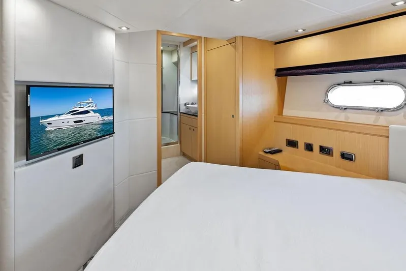 It's Enough Yacht Photos Pics Luxurious Sunseeker Manhattan 73 yacht bedroom interior, featuring modern amenities and elegant design.