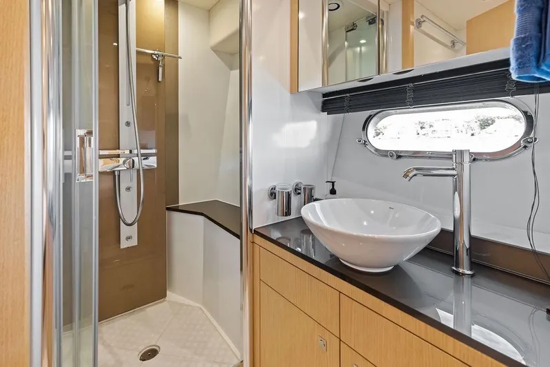 It's Enough Yacht Photos Pics Luxurious bathroom in 2013 Sunseeker Manhattan 73 yacht with modern fixtures and sleek design.