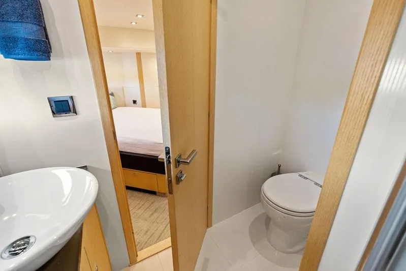 It's Enough Yacht Photos Pics Luxurious bathroom on 2013 Sunseeker Manhattan 73 yacht, featuring modern fixtures and elegant design.