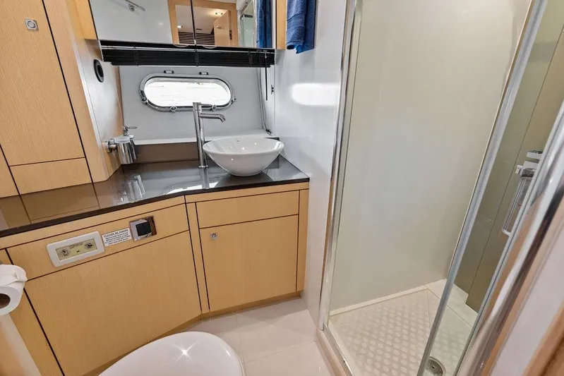 It's Enough Yacht Photos Pics Luxurious bathroom in 2013 Sunseeker Manhattan 73 yacht with modern fixtures and shower.