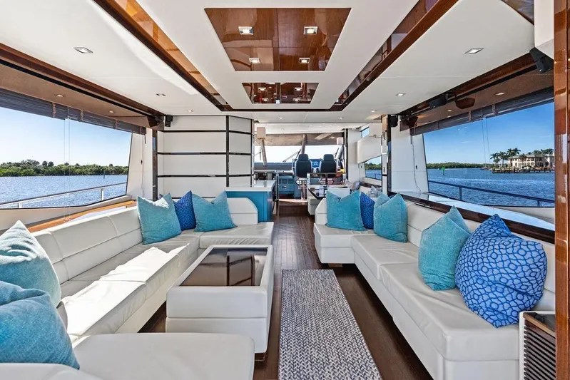 It's Enough Yacht Photos Pics Luxurious interior of 2013 Sunseeker Manhattan 73 yacht with elegant seating and scenic water views.