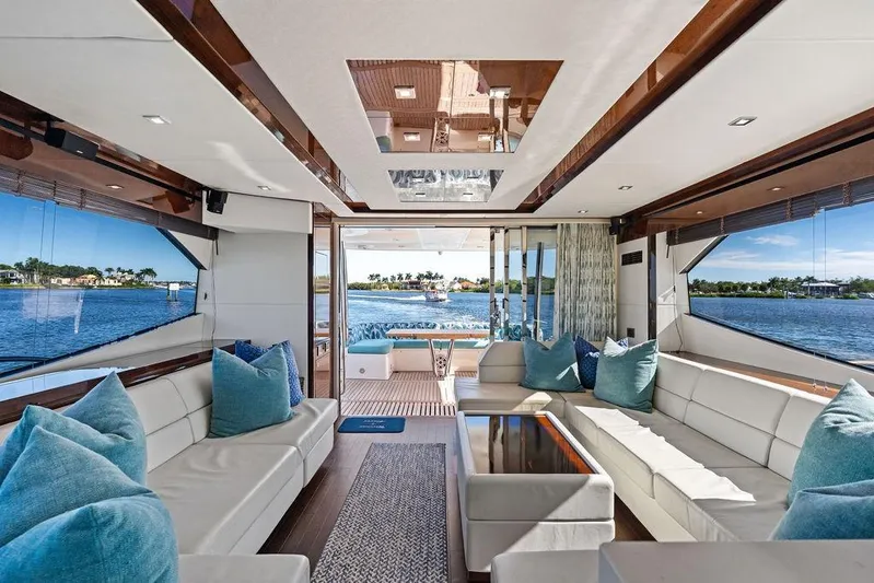 It's Enough Yacht Photos Pics Luxurious interior of 2013 Sunseeker Manhattan 73 yacht with elegant seating and scenic water views.