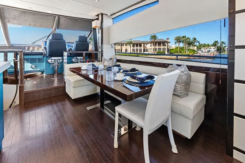 It's Enough Yacht Photos Pics Luxurious interior of 2013 Sunseeker Manhattan 73 yacht with elegant dining area.