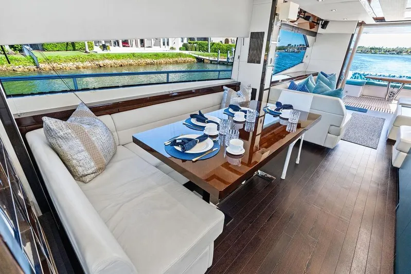 It's Enough Yacht Photos Pics Luxurious interior of 2013 Sunseeker Manhattan 73 yacht with elegant dining area.