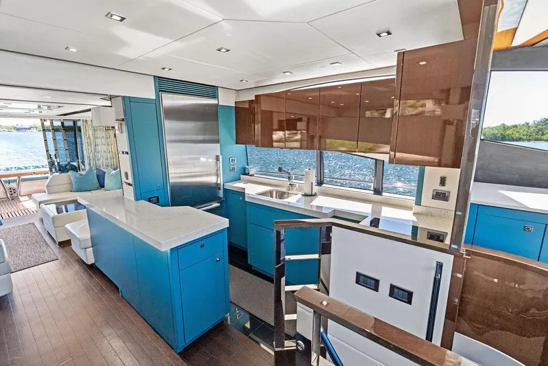 It's Enough Yacht Photos Pics Luxurious interior of 2013 Sunseeker Manhattan 73 yacht with modern kitchen and ocean view.