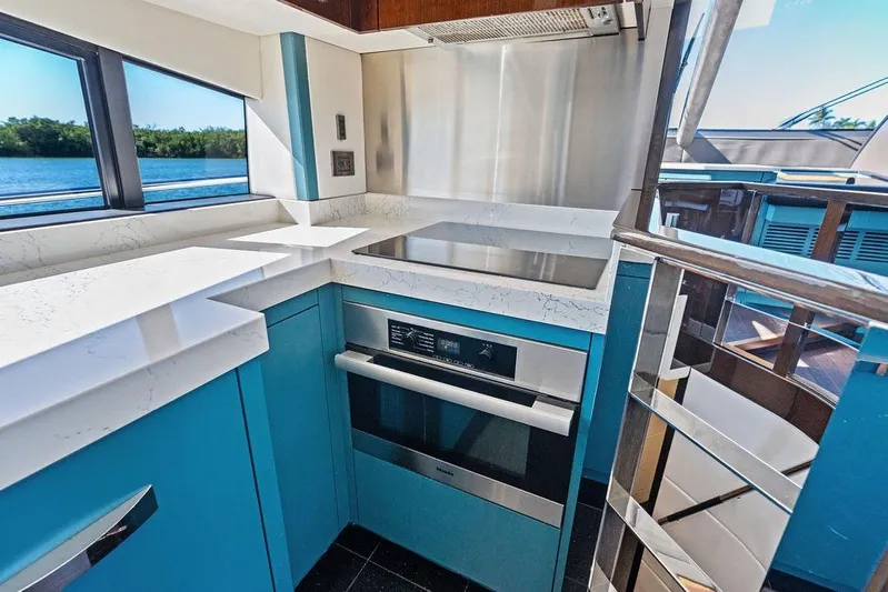 It's Enough Yacht Photos Pics Modern kitchen interior on 2013 Sunseeker Manhattan 73 yacht with sleek appliances and ocean view.