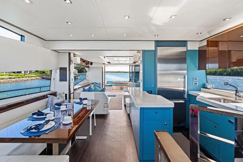 It's Enough Yacht Photos Pics Luxurious interior of 2013 Sunseeker Manhattan 73 yacht with elegant dining and kitchen area.