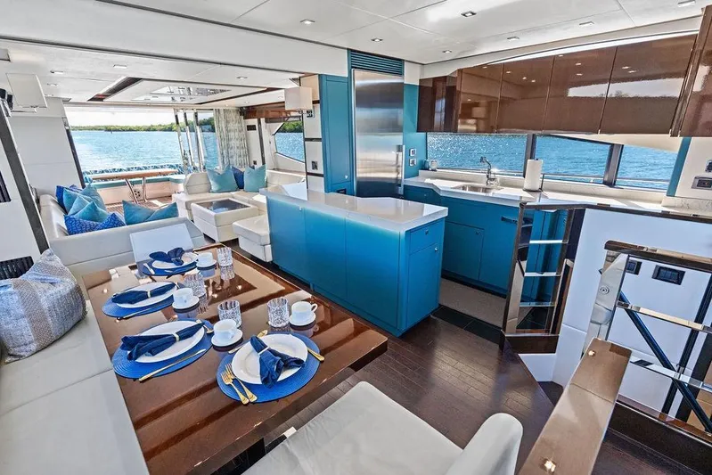 It's Enough Yacht Photos Pics Luxurious interior of 2013 Sunseeker Manhattan 73 yacht with elegant dining and kitchen area.