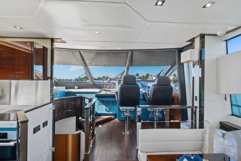 It's Enough Yacht Photos Pics Luxurious interior of 2013 Sunseeker Manhattan 73 yacht with modern helm and seating.