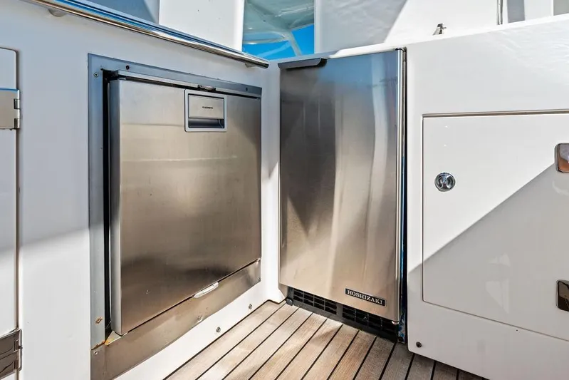 It's Enough Yacht Photos Pics Sunseeker Manhattan 73 yacht, 2013 model, featuring stainless steel appliances on deck.