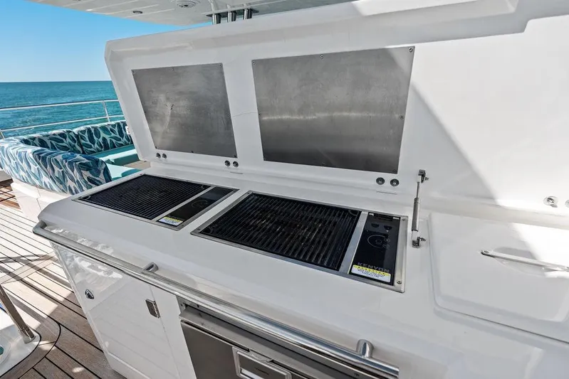 It's Enough Yacht Photos Pics Outdoor grill on 2013 Sunseeker Manhattan 73 yacht with ocean view and seating area.