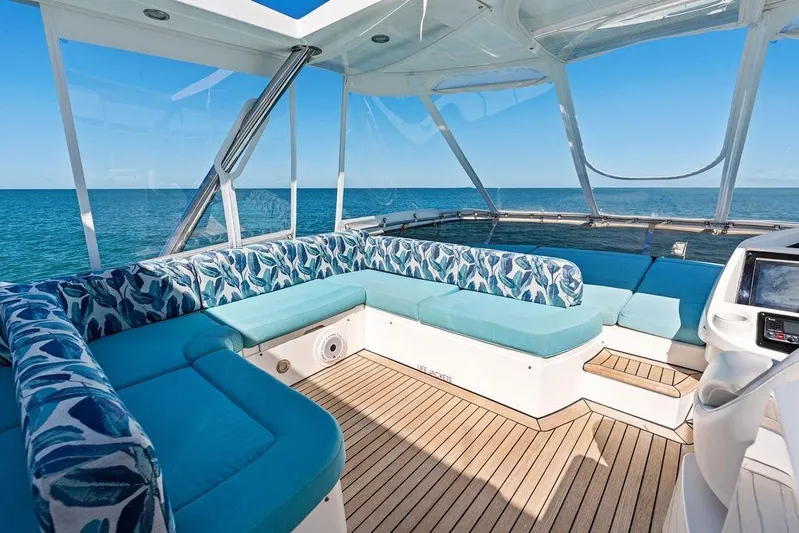 It's Enough Yacht Photos Pics Luxurious Sunseeker Manhattan 73 yacht interior with ocean view, featuring elegant seating, 2013 model.
