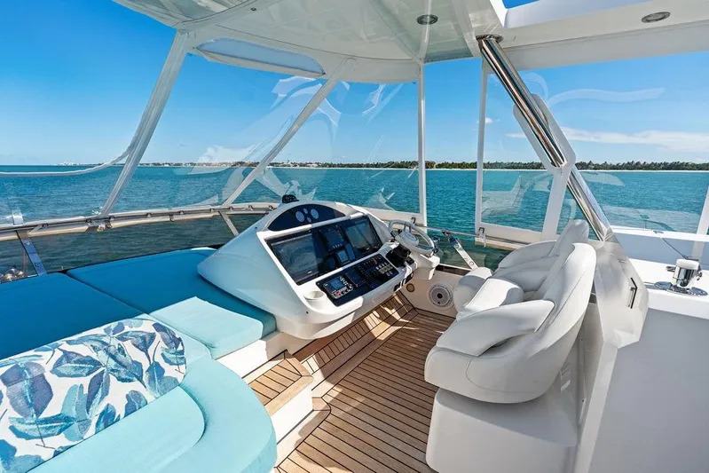It's Enough Yacht Photos Pics Luxurious 2013 Sunseeker Manhattan 73 yacht helm with ocean view and plush seating.