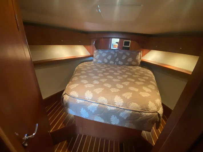 Reel Appeal Yacht Photos Pics Luxurious bedroom cabin in a 2006 Tiara Sport 39 yacht with cozy bedding.