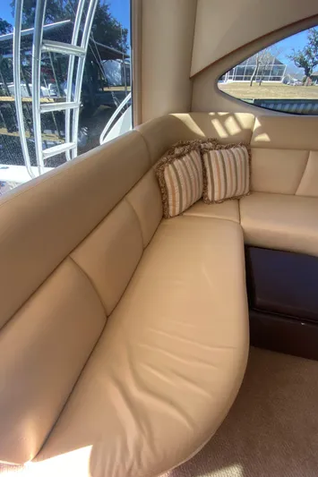 Reel Appeal Yacht Photos Pics Luxurious interior seating of a 2006 Tiara Sport 39 yacht with striped cushions.