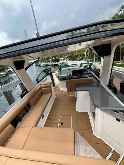 Yacht Photos Pics 2022 Aviara 32 boat interior with tan seating and sleek design.