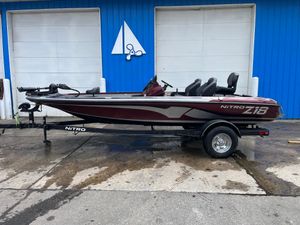 2022 Nitro Z18 boat on trailer, parked in front of blue building.