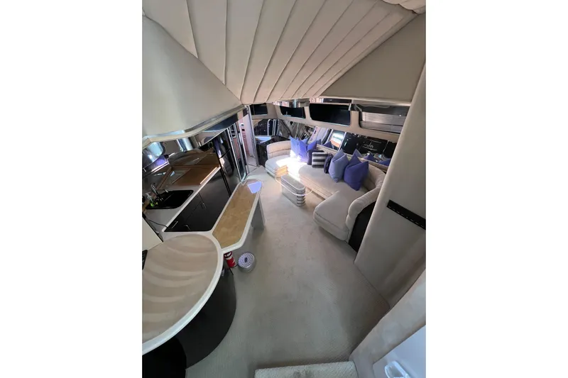 Fantom Yacht Photos Pics Luxurious interior of a 1990 Tempest 60 Express yacht with modern furnishings.
