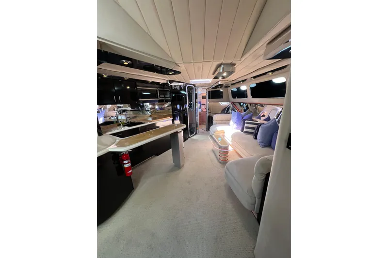 Fantom Yacht Photos Pics Luxurious interior of a 1990 Tempest 60 Express yacht with modern amenities and elegant design.