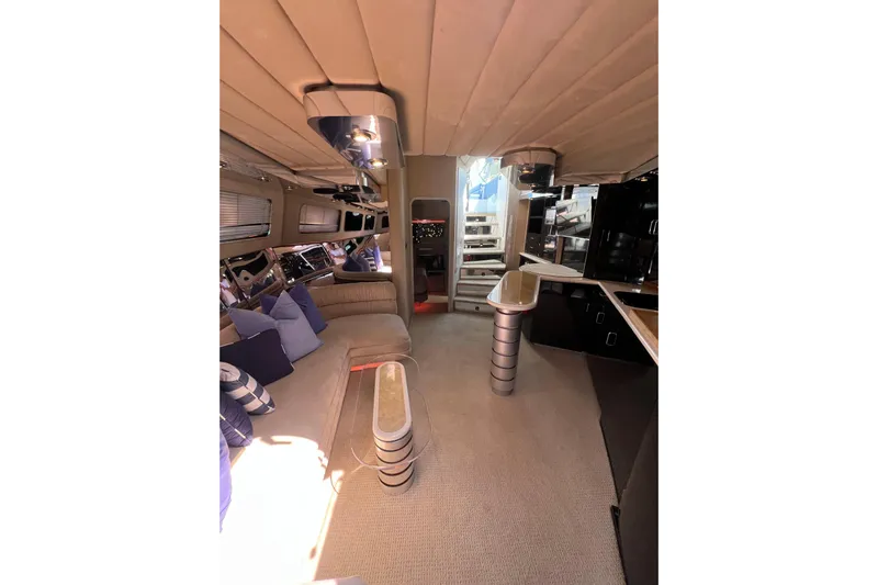Fantom Yacht Photos Pics Luxurious interior of a 1990 Tempest 60 Express yacht with modern furnishings.