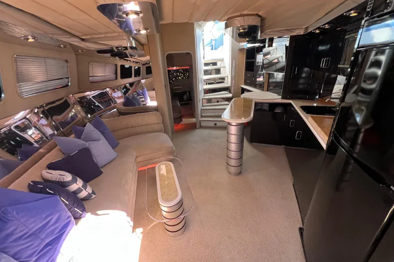 Fantom Yacht Photos Pics Luxurious interior of a 1990 Tempest 60 Express yacht with modern furnishings.