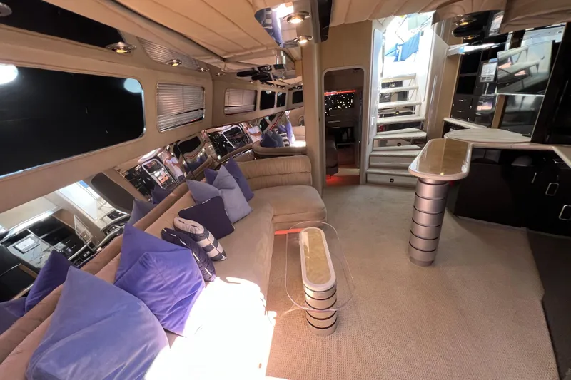 Fantom Yacht Photos Pics Luxurious interior of a 1990 Tempest 60 Express yacht with plush seating and modern design.