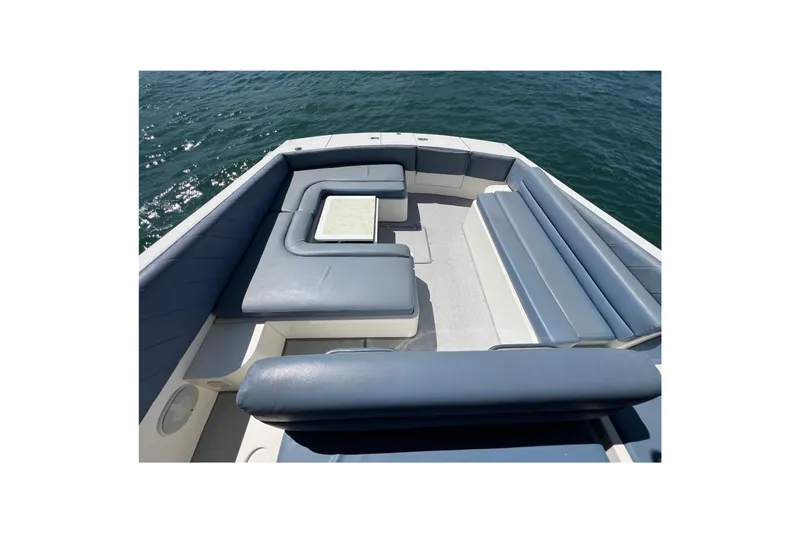 Fantom Yacht Photos Pics 1990 Tempest 60 Express boat with spacious seating on open water.