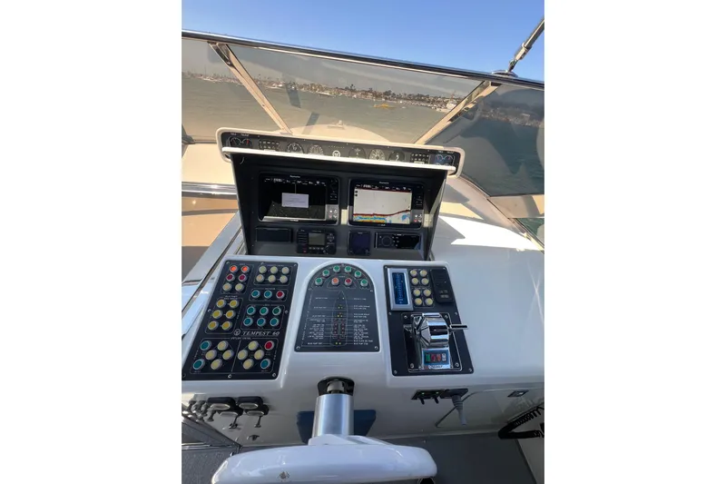 Fantom Yacht Photos Pics Cockpit of 1990 Tempest 60 Express yacht with navigation controls and displays.