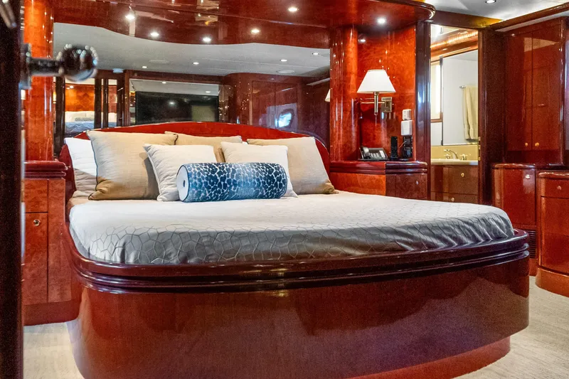 Yacht Photos Pics Luxurious bedroom interior of 2005 Ocean Alexander 80 Motoryacht with elegant wood finishes.